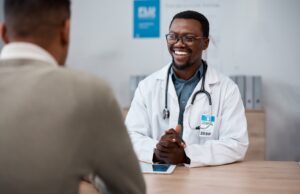 black-man-doctor-with-patient-in-consultation-office