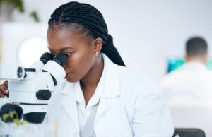 medical-science-black-woman-and-microscope-in-lab-2023-02-25-00-47-43-utc